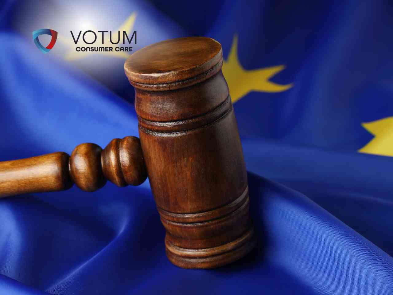 Judge's gavel resting on a blue European Union flag with yellow stars and the VOTUM Consumer Care logo in the corner