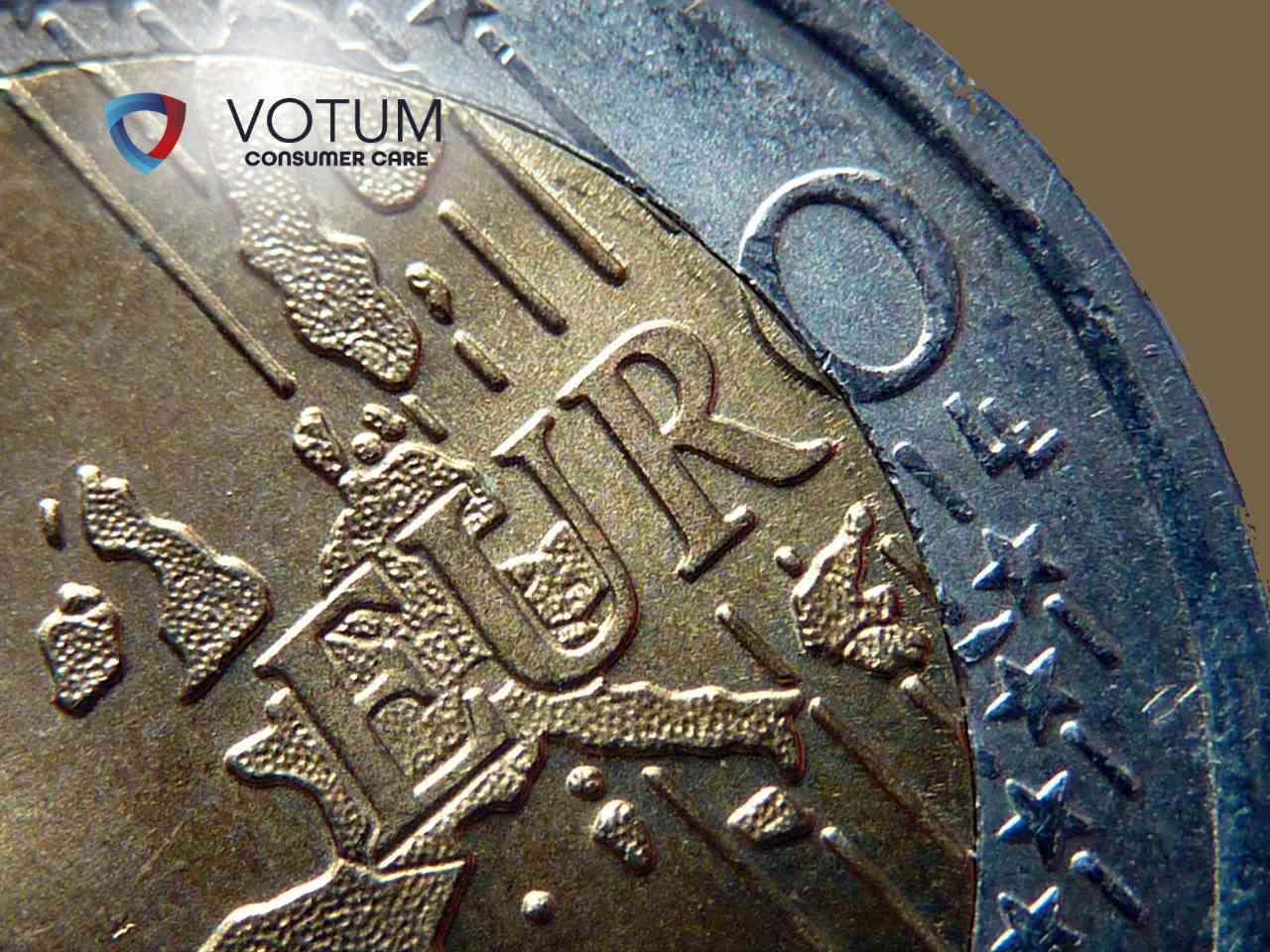 sadowe-zawieszenie-splaty-kredytu-w-euro Close-up of a coin with the VOTUM Consumer Care logo in the upper left corner