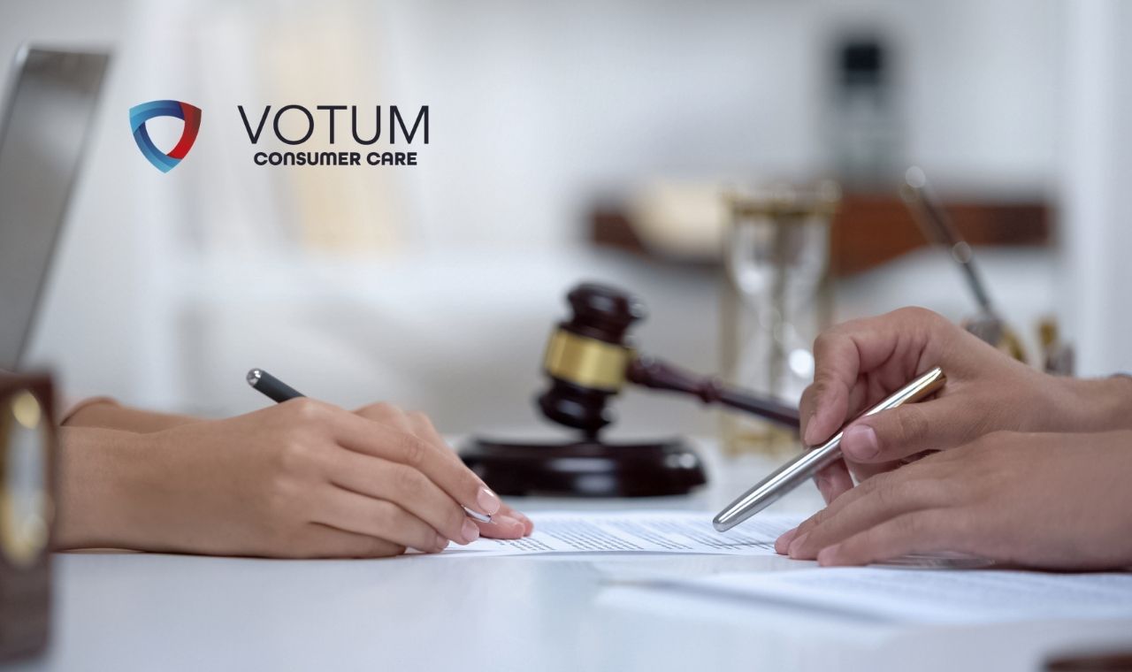 Two people sign a document at a desk, with a gavel and office items in the background, and the VOTUM Consumer Care logo visible on the left.